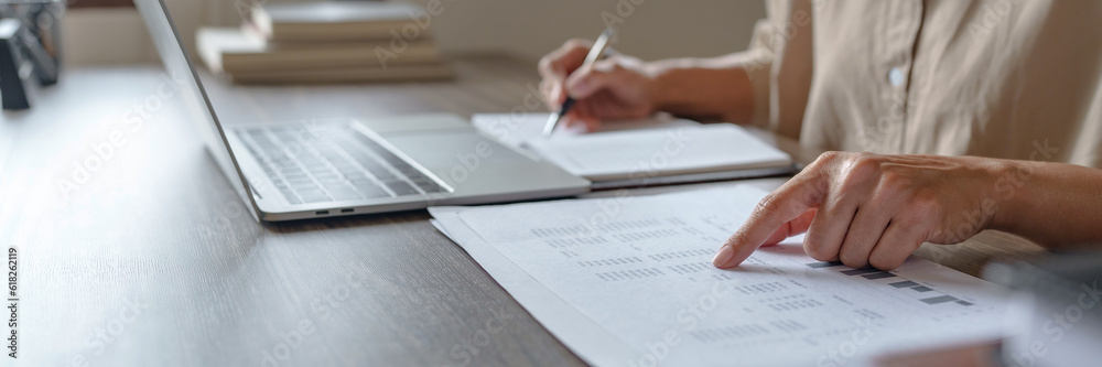 Image of woman calculate tax invoice at home, summarizing taxes, money planing. Image of woman calculate tax invoice at home, summarizing taxes, money planing.