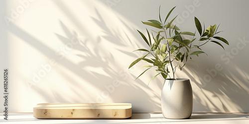  A contemporary square wooden podium tray on a glossy white counter with a tree twig vase casting leaf shadows, ideal for product displays.