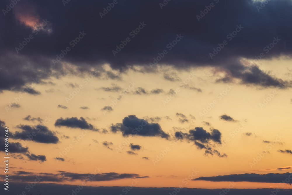 Dramatic sky. The background of the sunset sky with dark clouds.Soft focus