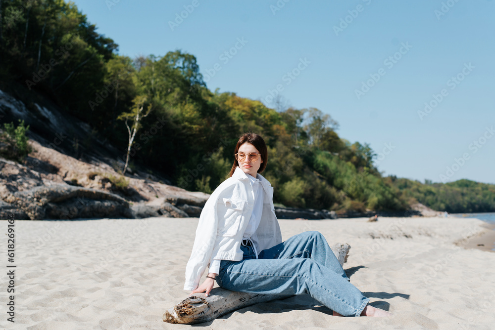 Lifestyle, lonely beautiful barefoot woman resting on the seashore, mood Lifestyle, lonely beautiful barefoot woman resting on the seashore, mood