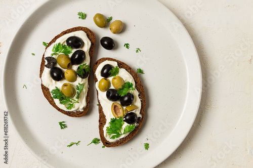 Breakfast, sandwiches, with cream cheese, olives, top view,