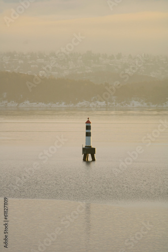 A lighthouse at sunset