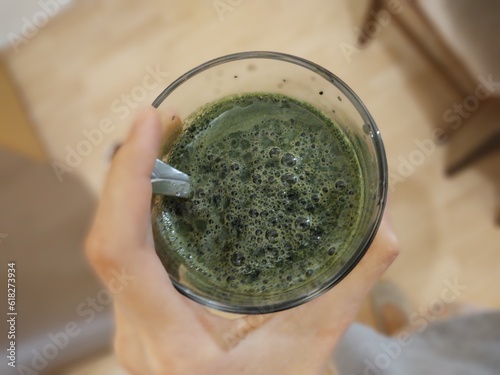 Young green barley or chlorella green food in the cup or bowl. Slovakia