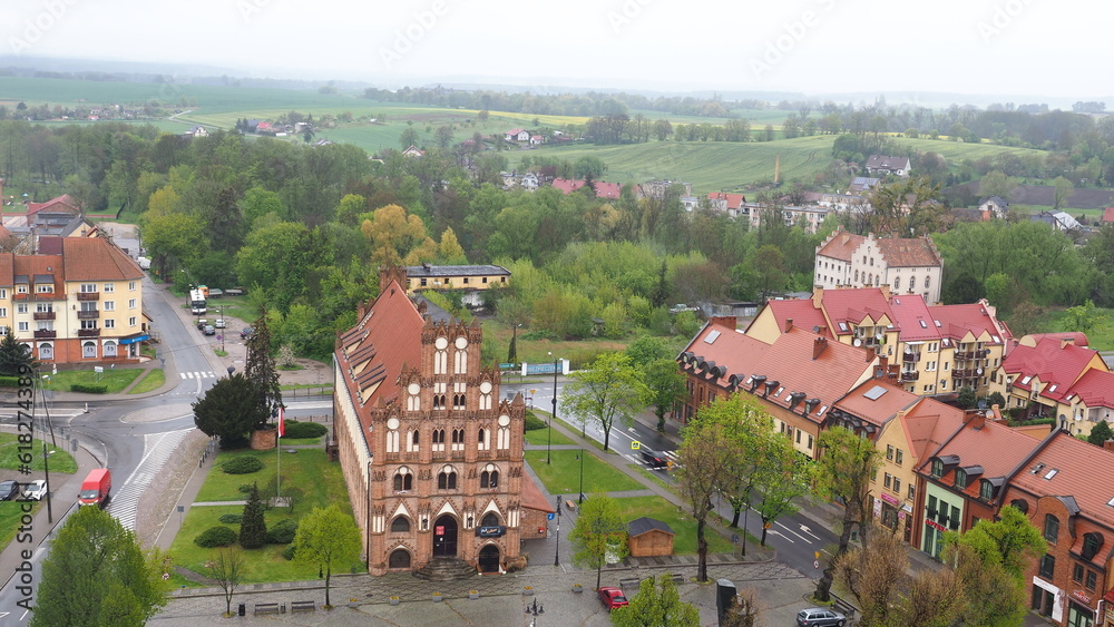 Old town hall building and rural scenery in the background - Chojna Poland