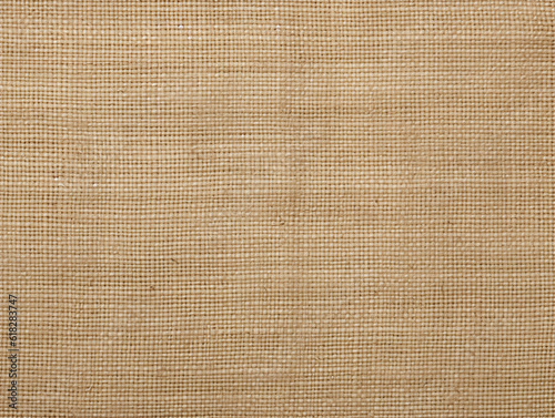 Jute hessian sackcloth canvas woven texture pattern background in beige brown color 
