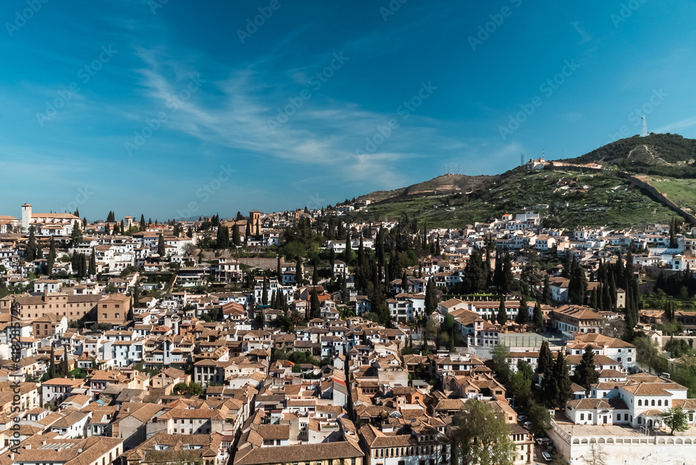 Granada,Spain. April 14, 2022:  Albaicin neighborhood architecture and blue sky. Panoramic landscape of the neighborhood.