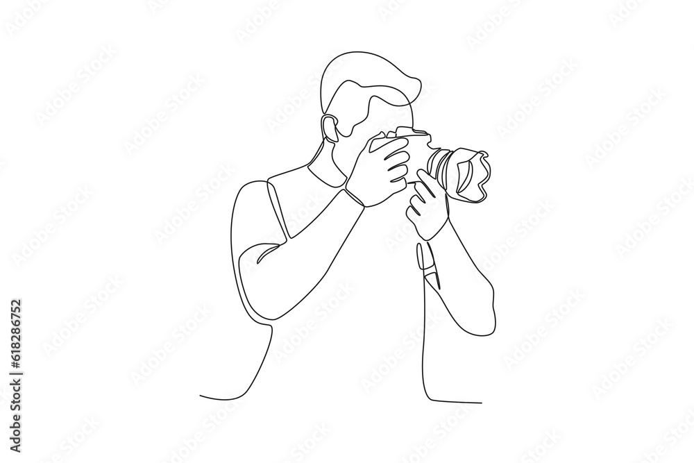 A man using a digital camera. World photography day one-line drawing A man using a digital camera. World photography day one-line drawing