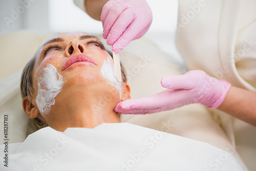 Women struggle for the beauty and youthfulness of the skin - anti-aging injections of the face and hands - lifting and fillers procedure