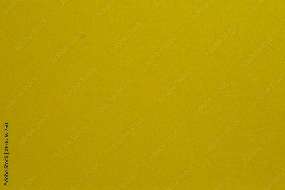 Yellow paper texture background or cardboard surface from a paper. For the designs decoration and nature background concept Yellow paper texture background or cardboard surface from a paper. For the designs decoration and nature background concept