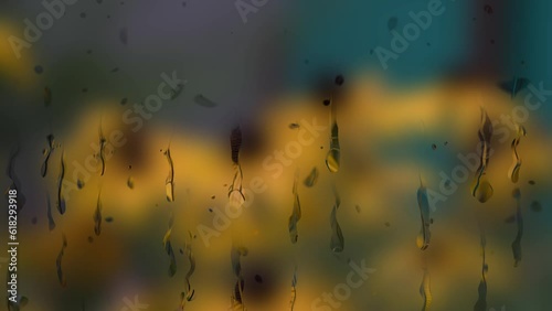 animation of raindrops on the window on the background yellow flowers