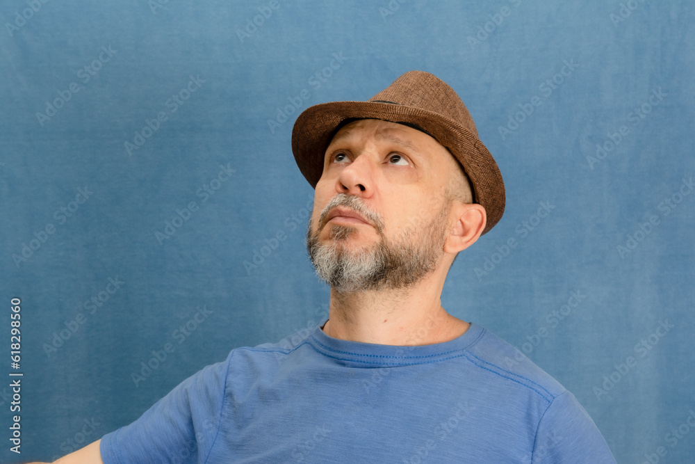 Portrait of bearded man wearing hat posing for photography. Portrait of bearded man wearing hat posing for photography.
