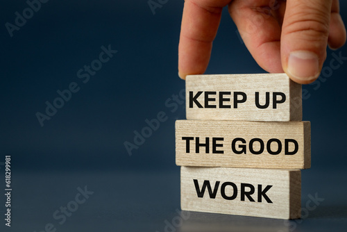 Obraz na płótnie Keep up the good work, text is written on wooden blocks, Business concept, Motivating slogan, work commitment, copy space w salonie