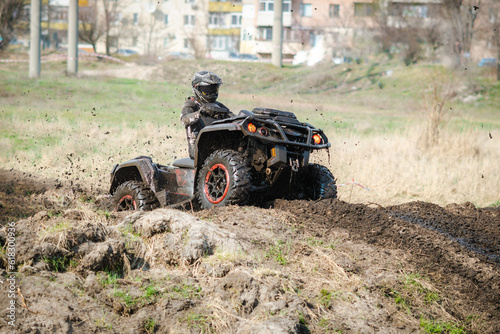 ATV, buggy, quad and UTV offroad vehicle rally in dust with mud splash. Extreme, adrenalin. 4x4