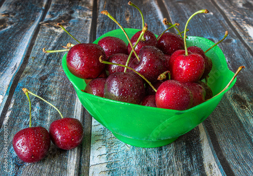 Red cherries in a plate close-up