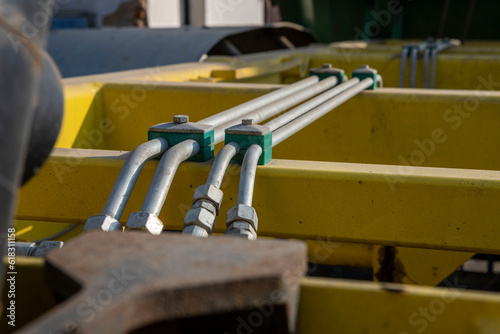 Metal pipes of the hydraulic system.