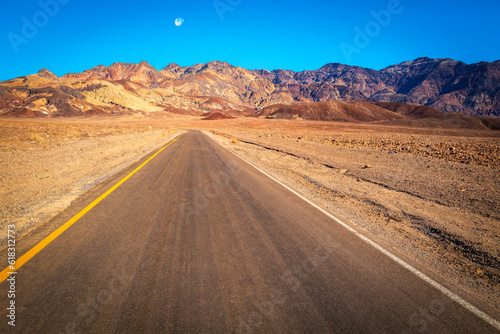 Road to the wilderness mountain in the desert. Dramatic arid landscape at Death Valley National Park, California in the summer