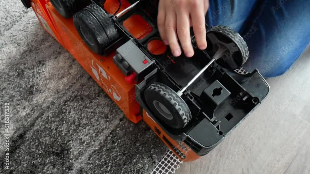 Little boy is playing with toy cars at home Little boy is playing with toy cars at home