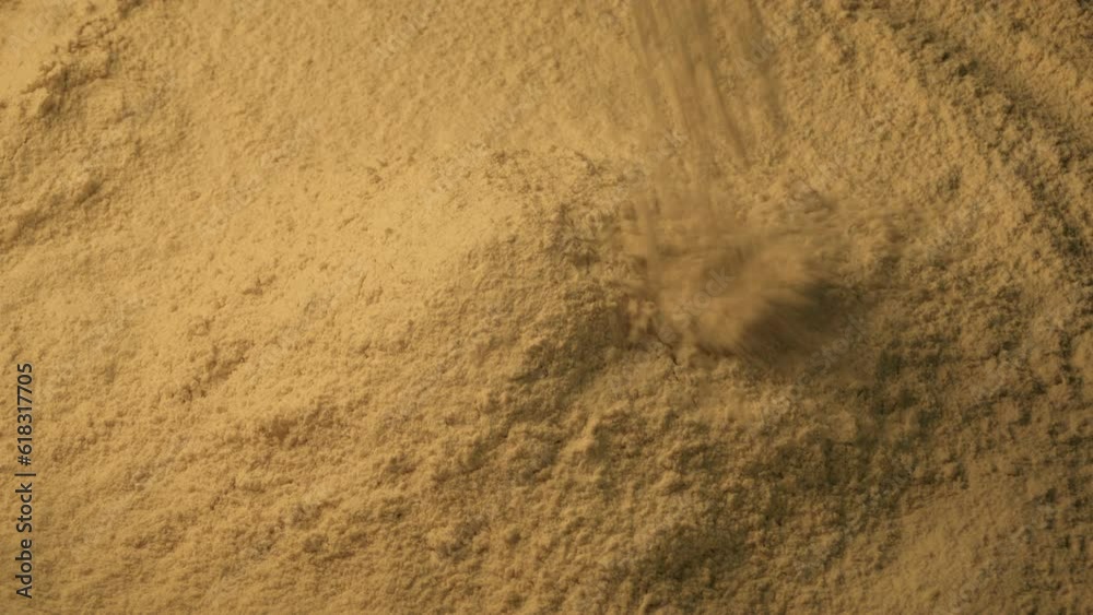 Cinnamon Powder Pours Into Pile