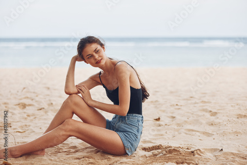 woman nature vacation hair travel freedom sitting smile beach sand sea