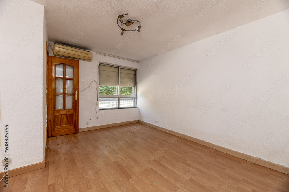 Living room of an empty apartment with pine wooden Living room of an empty apartment with pine wooden