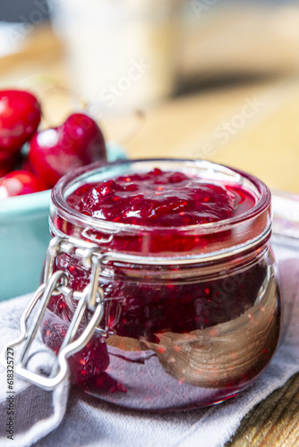 An airtight glass jar filled with berry jam