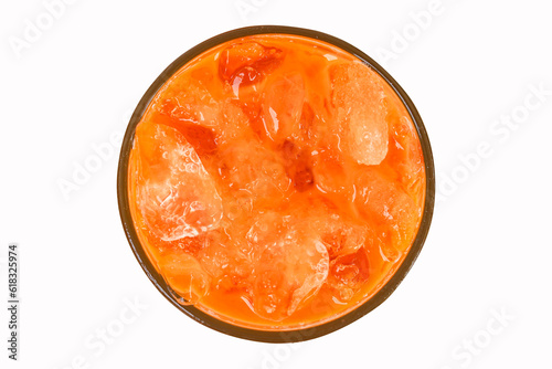 Iced milk tea color orange with crushed ice in glass on top corner. Refreshing drink is popular in tropical countries. Isolated on white background. Packed with old fashioned bags.