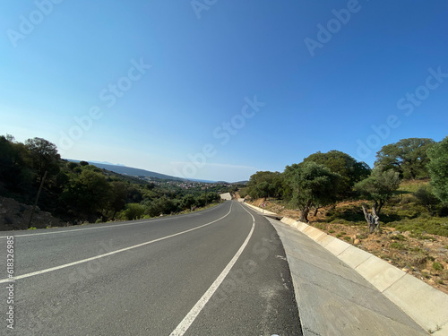 Asphalt road with beautiful nature view from Gökçeada center to Aydıncık Kefalos beach. Imbros island, Çanakkale, Turkey