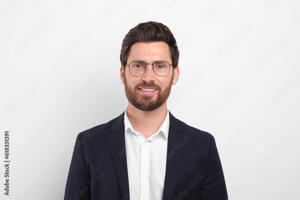 Portrait of handsome man in glasses on white background