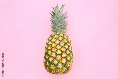 Delicious ripe pineapple on pink background, top view