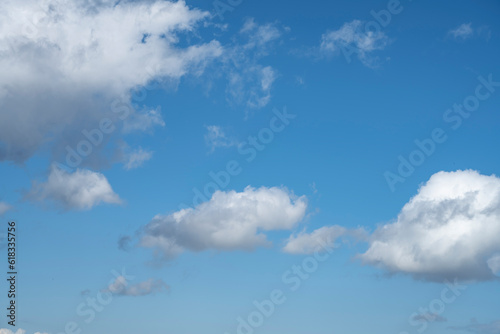 White clouds in the blue sky. Sky with air clouds