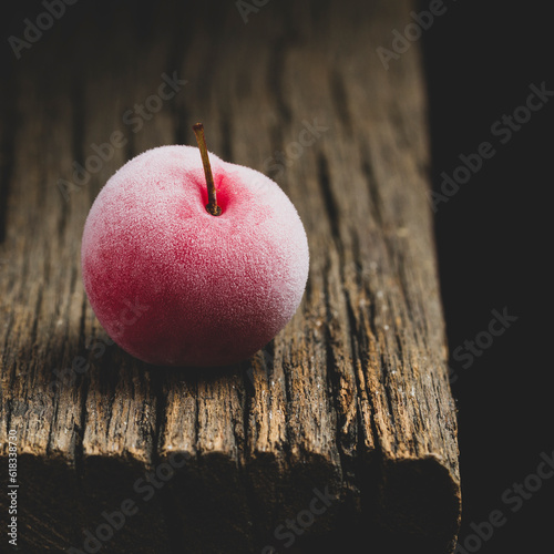 Tableau sur toile delicious plum on old wood and dark background