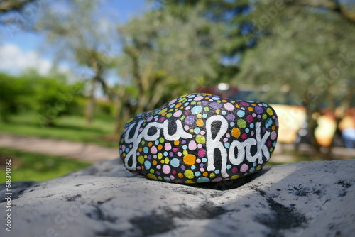 You rock encouraging message painted in script on kindness rock photo