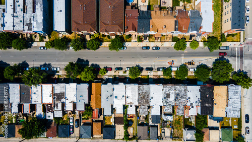 aerial overhead drone view of a Chicago urban neighborhood during the afternoon .  the residential area is has colorful buildings great for a background