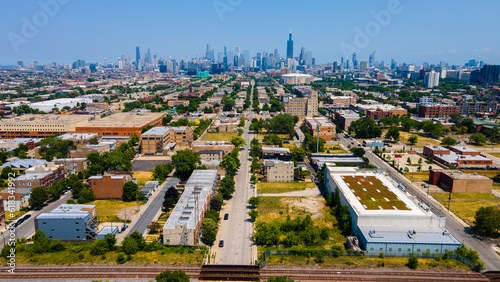 aerial overhead drone view of a Chicago urban neighborhood during the afternoon .  the residential area is has colorful buildings great for a background
 photo