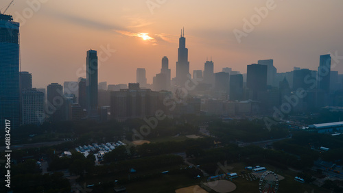 aerial drone view of the of Chicago  during a time when the pollution levels in the air are toxic and not safe for citizens. the wild fires from Canada are the cause of the environmental hazard 