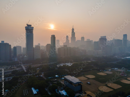 aerial drone view of the of Chicago  during a time when the pollution levels in the air are toxic and not safe for citizens. the wild fires from Canada are the cause of the environmental hazard 