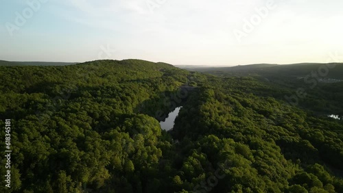 Sunset aerial over forest and pond in eastern Pennsylvania at sunset near Hazleton photo