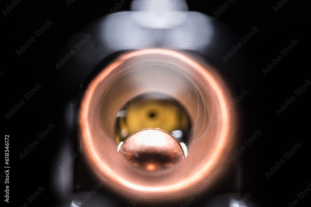 Macro view of weapon barrel with bullet at the end Macro view of weapon barrel with bullet at the end