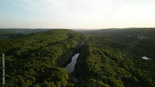 Sunset aerial over forest and pond in eastern Pennsylvania