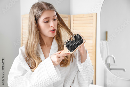 Young woman with hair loss ...