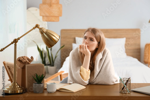 Thoughtful young woman with...