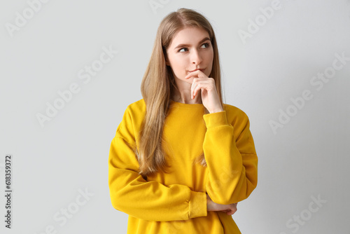 Thoughtful young woman on l...