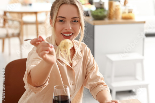Young woman eating tasty pa...