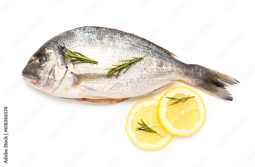 Raw dorado fish with lemon on white background Raw dorado fish with lemon on white background