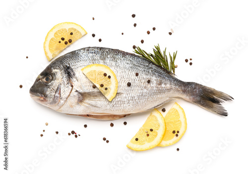 Raw dorado fish with lemon on white background photo