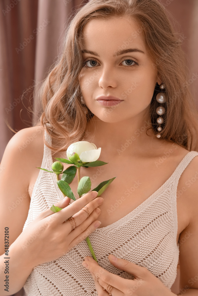 Beautiful young woman with peony flower, closeup Beautiful young woman with peony flower, closeup