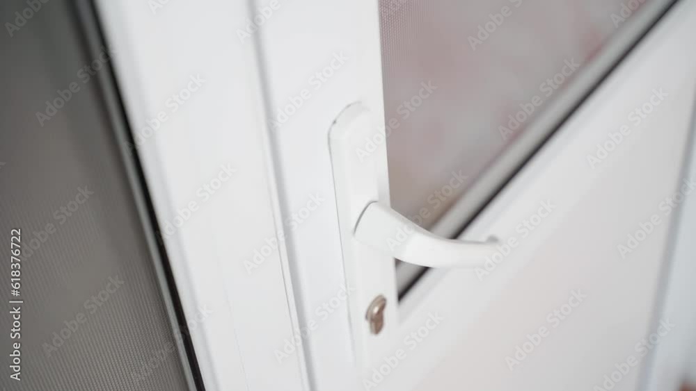 The door slammed shut with people inside. People are trying to break down a plastic door from the inside The door slammed shut with people inside. People are trying to break down a plastic door from the inside