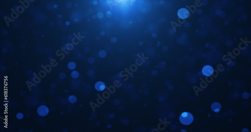 Abstract background of blue glowing particles and bokeh dots of festive energy magic