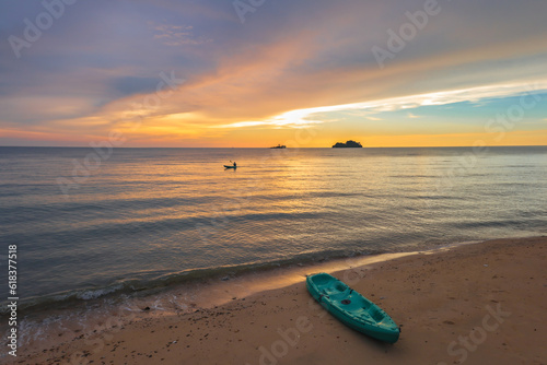 Fototapeta Naklejka Na Ścianę i Meble -  Kayak at the tropical beach at beautiful sunset.