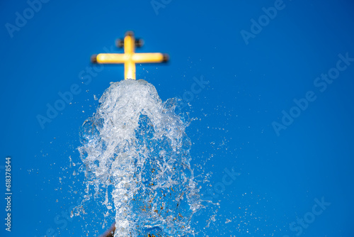 Church on the background of a fountain water jet.